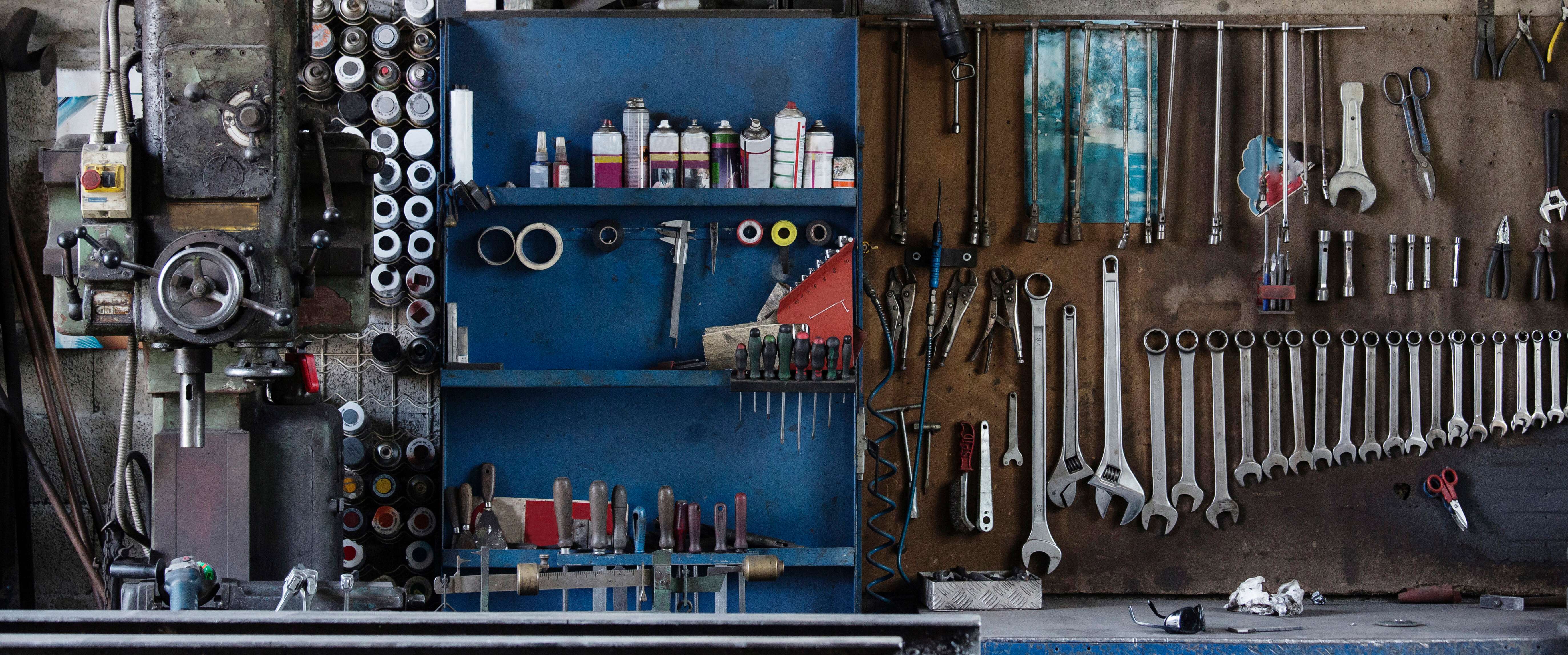 Well-organized mechanic's workshop with professional tools and equipment, representing the professional automotive service environment protected by garage keepers insurance