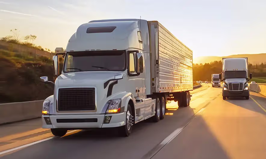 Commercial truck fleet representing comprehensive business vehicle insurance coverage for commercial auto policies