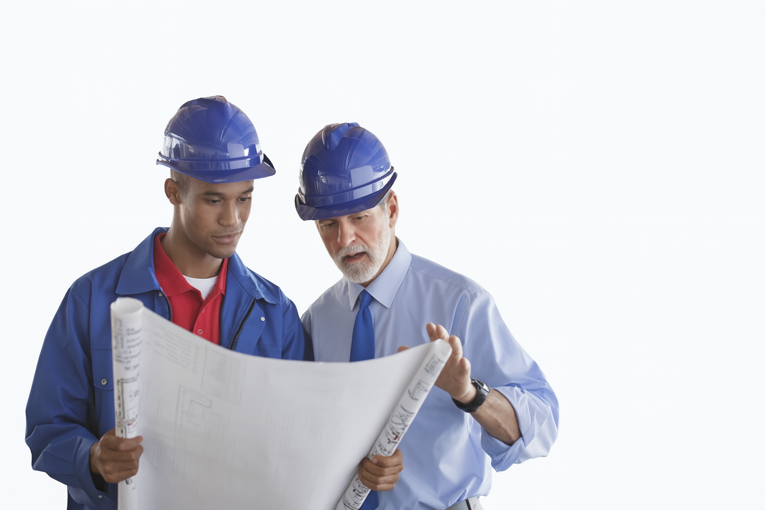 Construction professionals reviewing blueprints representing professional liability insurance coverage for engineering and architectural services