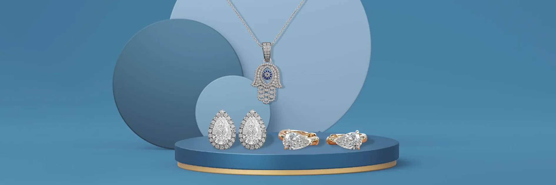 Elegant diamond jewelry collection including Hamsa pendant necklace and diamond earrings representing valuable jewelry requiring comprehensive insurance coverage