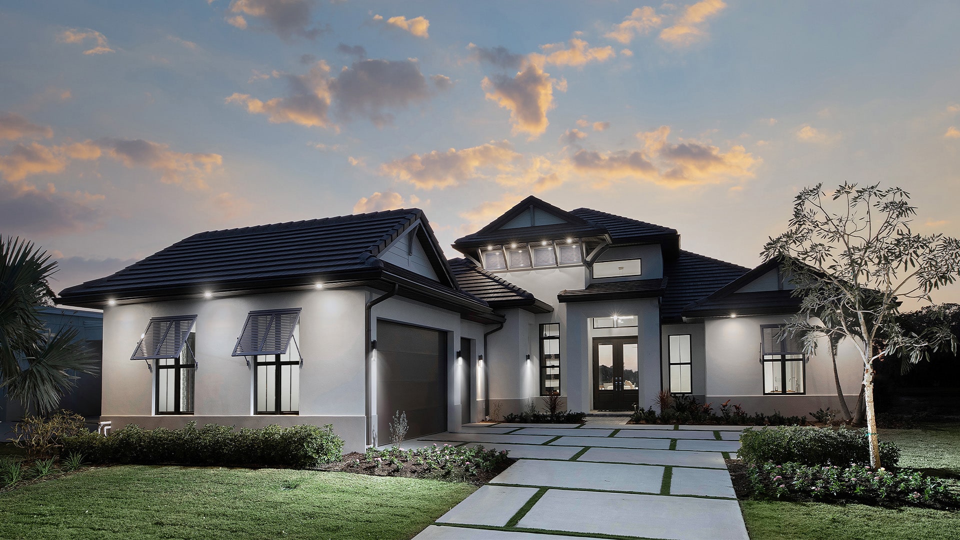 Beautiful modern luxury home at twilight showcasing comprehensive home insurance coverage for high-value properties