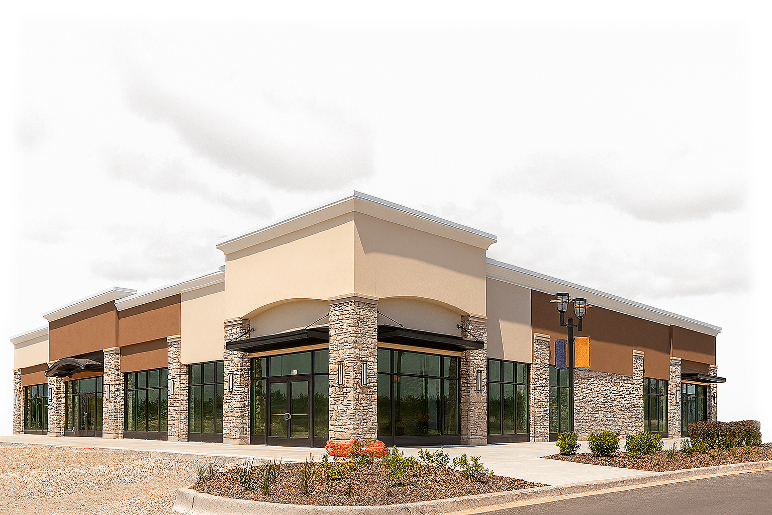 Modern commercial retail building with stone facade and large windows representing comprehensive business property insurance coverage